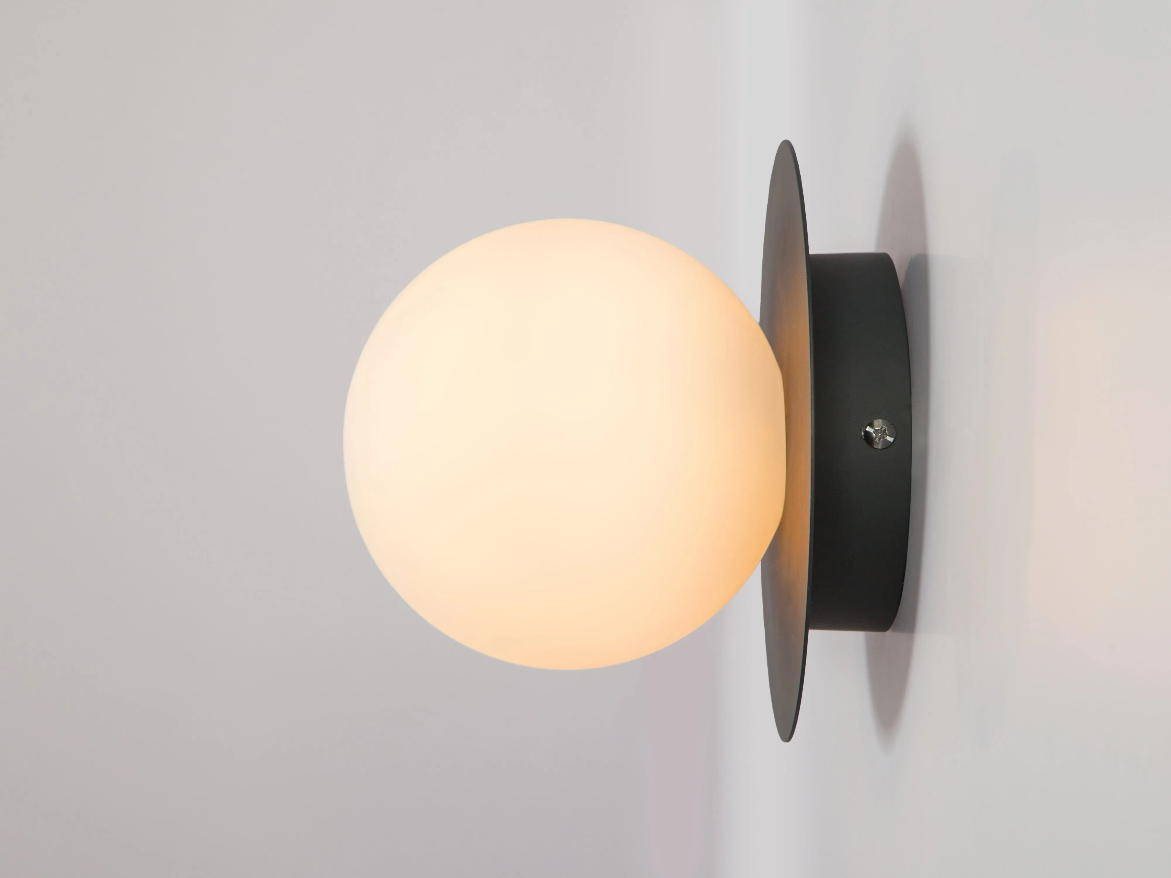 Charcoal grey opal disk wall light