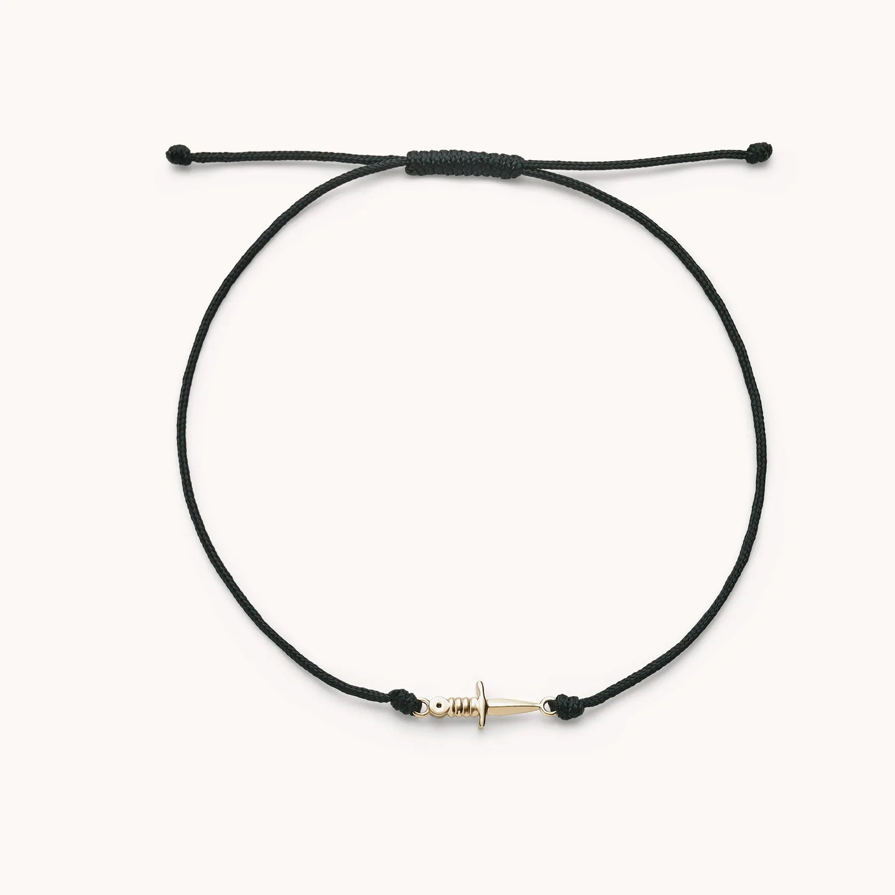 the dagger contemplation cord bracelet - 10k yellow gold, black cord